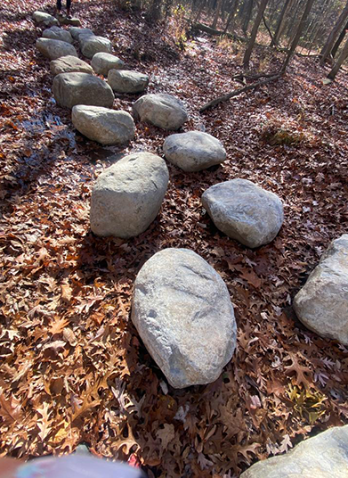 Placing stream crossing boulders for visitors